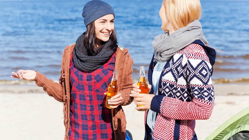 Two Women Enjoying Themselves While Drinking Non Alcoholic Beer