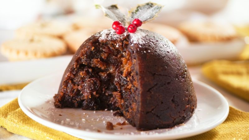 get stuffed with a delicious christmas pudding topped with custard