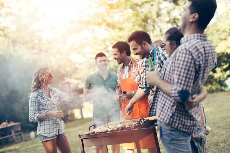 Group Of Friends At A Barbecue Having Non Alcoholic Drinks And Food (2)