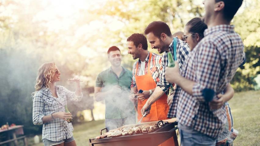 Group Of Friends At A Barbecue Having Non Alcoholic Drinks And Food (2)